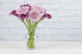 Vase of pink and purple flowers isolated on a white background Royalty Free Stock Photo