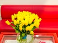 Vase of yellow tulips in modern living room Royalty Free Stock Photo