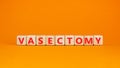 Vasectomy symbol. Concept words Vasectomy on wooden blocks. Beautiful orange table orange background. Medical and vasectomy