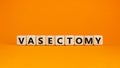 Vasectomy symbol. Concept words Vasectomy on wooden blocks. Beautiful orange table orange background. Medical and vasectomy
