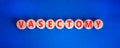 Vasectomy symbol. Concept words Vasectomy on wooden circles. Beautiful blue table blue background. Medical and vasectomy problem