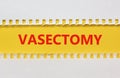 Vasectomy symbol. Concept words Vasectomy on yellow and white paper. Beautiful white background. Medical and vasectomy problem