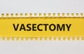 Vasectomy symbol. Concept words Vasectomy on yellow and white paper. Beautiful white background. Medical and vasectomy problem