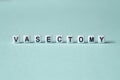 Vasectomy - word concept on cubes