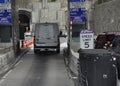 A vasn goes thru a toll booth entering New York City