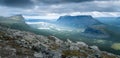 Vast arctic landscape of Sarek National Park in Swedish Lapland with Rapa valley, Tjahkelij, Skierffe, Nammasj peaks and Royalty Free Stock Photo