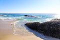 Vast blue ocean water with waves crashing against the rocks Royalty Free Stock Photo