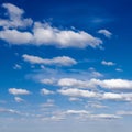 A vast blue sky with white clouds