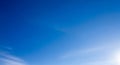 Vast Blue Sky with Wispy Clouds and Bright Sunlight Royalty Free Stock Photo