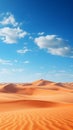 A vast desert landscape, with sand dunes stretching out as far as the eye can see and a small oasi Royalty Free Stock Photo