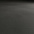 A vast, empty dark gray surface with a subtle texture, reminiscent of smooth asphalt or concrete. Royalty Free Stock Photo