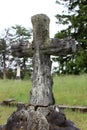 Old weathered cross with smaller headstones surrounding area, Greenridge Cemetery, Saratoga Springs, New York, 2018