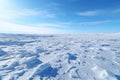 Vast frozen tundra at midday. Empty clear horizon. Plain after a snowstorm. Winter landscape Royalty Free Stock Photo