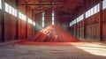 A vast heap of vibrant red sand is meticulously stored in a spacious warehouse used in the processing of potash fertilizers