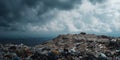 A Vast Landfill Overflowing with Waste Against a Darkening Sky Highlighting Environmental Concerns and Pollution Issues Royalty Free Stock Photo
