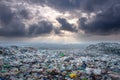 A vast landfill under a dramatic sky, highlighting environmental pollution. Royalty Free Stock Photo