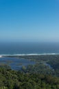 Vast ocean and river mouth lagoon surrounded by forest. Aerial landscape Royalty Free Stock Photo