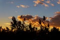 Vast orange speckled clouds form bowl in Autumn sunset sky in semi Royalty Free Stock Photo