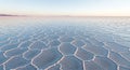 Vast salt flat with geometric patterns reflecting dawn Royalty Free Stock Photo