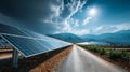Vast Solar Farm Under Dramatic Skies with Mountains and Road Royalty Free Stock Photo
