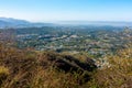 Vast spreaded Dehradun Valley with buildings and resiential homes amid mountain valley as seen from a Mussoorie Hilltop Royalty Free Stock Photo