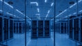 Modern Data Center with Rows of Server Racks Illuminated by Blue Light - Technology Concept Royalty Free Stock Photo