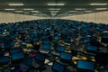 Vast warehouse filled with discarded laptops and electronic waste materials Royalty Free Stock Photo