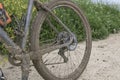 VASTO, ITALY - APRIL 29, 2023:  A mountain biker is making a stop on a very dirt road. Close up shot of the muddy wheel Royalty Free Stock Photo