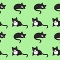 Cute black cat is sleeping and purring on a green background. Seamless pattern.