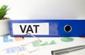 VAT - blue binder on desk in the office Royalty Free Stock Photo