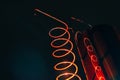 Vat and metallic spiral of alcohol machine red illuminated