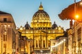 Vatican City by night. Illuminated dome of St Peters Basilica and St Peters Square at the end of Via della Conciliazione Royalty Free Stock Photo