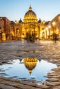 Vatican City by night. Illuminated dome of St Peters Basilica and St Peters Square. Group of tourists on Via della Royalty Free Stock Photo