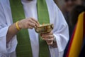 Catholic priest giving a Swiss Guard the Holy Communion