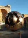 Vatican City, Rome / Italy - November 01, 2019: a golden metal ball representing the broken planet Earth. The insides of the