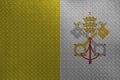 Vatican City State flag depicted in paint colors on old brushed metal plate or wall closeup. Textured banner on rough background Royalty Free Stock Photo