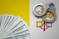 Vatican City State flag with handcuffs and a bundle of dollars. The concept of illegal banking operations in US currency