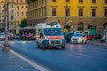 VATICAN, ITALY - JUNE 13, 2015: Ambulance van going fast on Rome streets, behind cars waitting