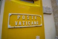 VATICAN, ITALY - JUNE 13, 2015: Box post of Vatican city, yellow color with white letters on wall Royalty Free Stock Photo