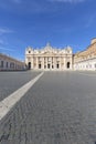 Facade of Saint Peter`s Basilica Egyptian and obelisk at St.Peter`s square. Few tourists wearing face masks due to the Covid-19