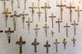 Vatican, Rome, Italy - October, 2019: Many metal and wooden crucifix for sale in a shop inside The St Peter Basilica in Vatican Royalty Free Stock Photo