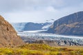 Vatnajoekull glacier in Iceland eternal ice deep blue flowing down the mountain Royalty Free Stock Photo