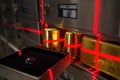 Vault containing gold bars and a diamond under red laser security in a high tech facility Generative AI