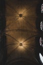 the vaulted ceiling in a cathedral with stained glass windows and wood