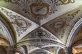 Vaulted ceiling of the chapel decorated with paintings and religious frescoes of angels and allegorical figures with human skulls