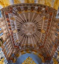 Vaulted ceiling luxuriously decorated with baroque architectural paintings of columns and cathedral ceiling of the Church of San Royalty Free Stock Photo