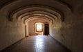 Vaulted corridor with a large window, interior of the Convent of Christ, Tomar, Portugal Royalty Free Stock Photo