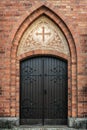 Vaulted and ornamented entrance door to an old Swedish church Royalty Free Stock Photo