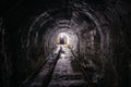 Vaulted tunnel with concrete walls in old abandoned bunker, mine, drainage, subway, etc