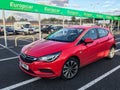 Vauxhall Opel Astra K red hatchback rental car in front of Europcar rental company depot at the airport